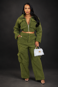 Green pant set on a dark professional studio background