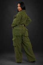 Second angle of green pant set on a dark studio background